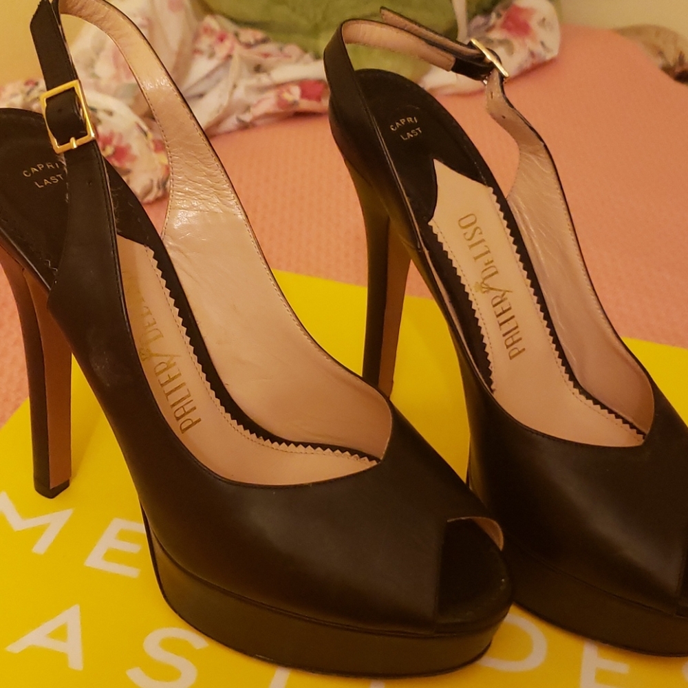 I am selling Palter DeLiso black heeled platforms.